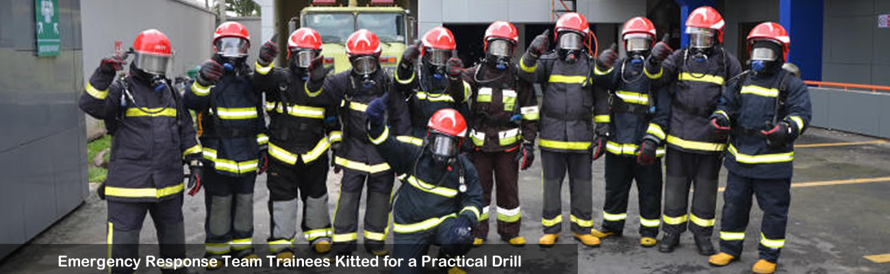 Delegates using fire extinguishers during practical training