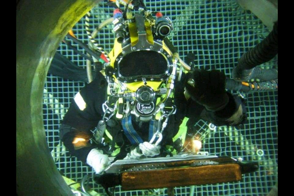Sea survival training at Tolmann with delegates in survival suits