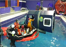 Delegates at Simulation Dunker training for helicopter underwater escape